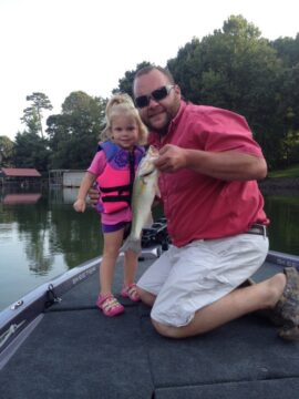 Gwyn catches a big one with her daddy Jesse Smith.