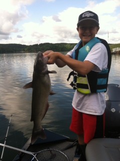 Lane Bailey reeled in this 12 pound catfish on Lake Rhodhiss from his family's new Alumacraft boat. 